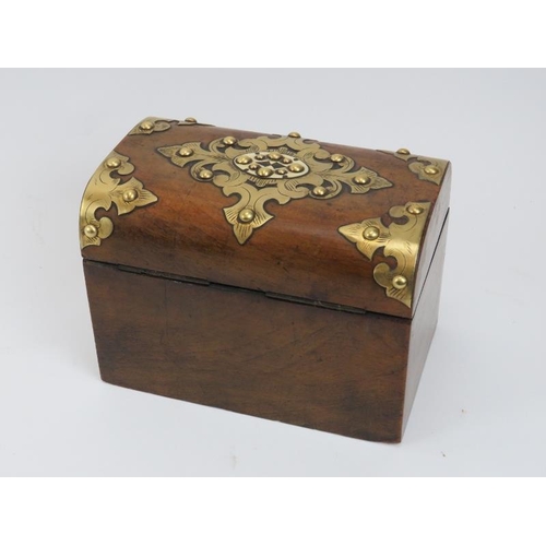 218 - A brass bound walnut domed tea caddy, 19th century. With compartmented interior. Key included. 17.8 ... 