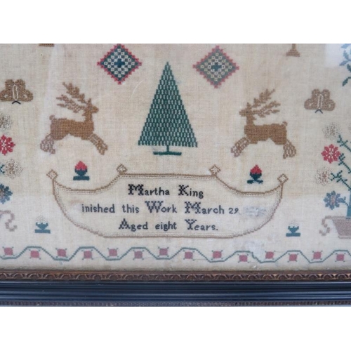 220 - An early 19th Century child's needlework sampler by Martha King, aged 8 years.  Year is indistinct. ... 