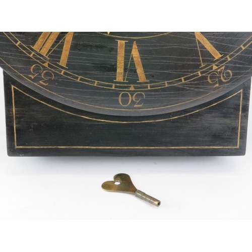 222 - A large Georgian wall clock with fusee movement. The black painted dial with gilt Roman and Arabic n... 