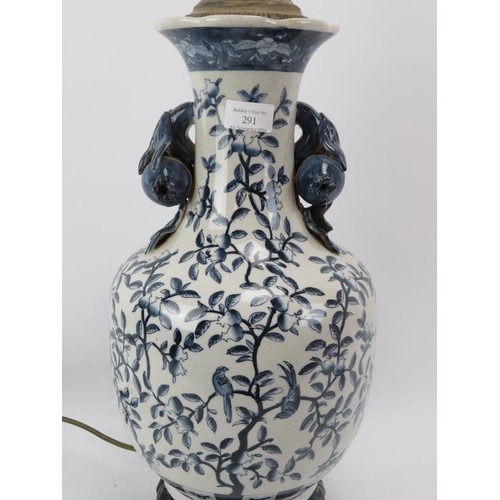 227 - A large ceramic lamp base with Pomegranate Tree decoration and Pomegranate form handles, standing on... 