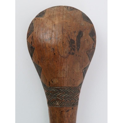 237 - A South Pacific hardwood club with incised decoration. 34 cm length. 
Condition report: Some age rel... 