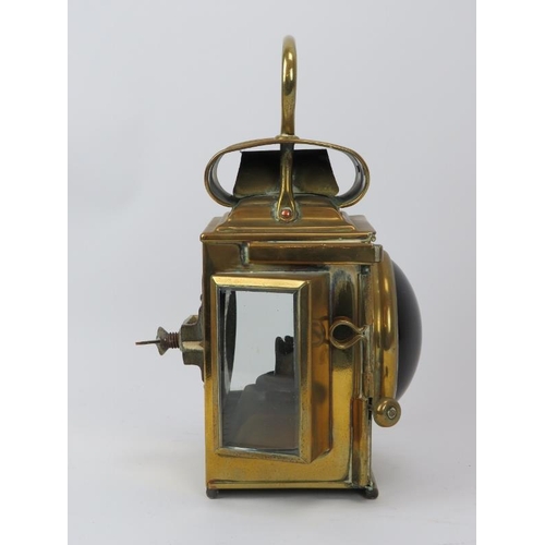 247 - A Victorian brass fire engine lantern by Merryweather & Sons Ltd of London. With convex red glass le... 