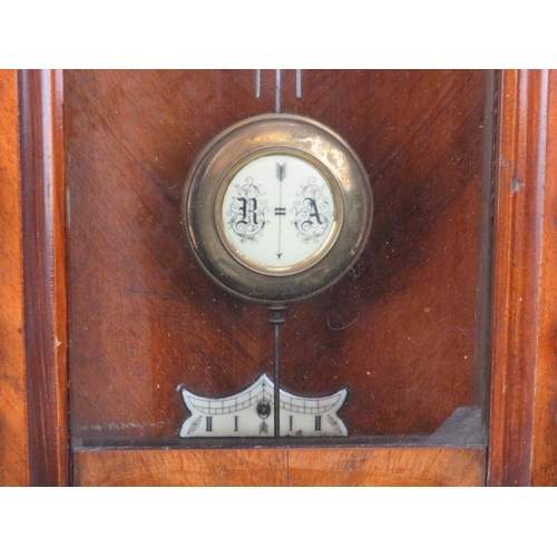 251 - A large mahogany wall clock, late 19th/early 20th century. Probably Austrian or German. Key and pend... 