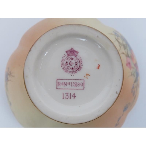 258 - A Royal Worcester florally decorated blush ivory ground potpourris jar, dated 1905. With internal li... 