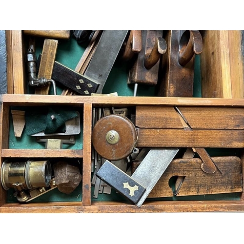 284 - A large black painted pine tool chest containing ship builders tools and related items. Including bl... 