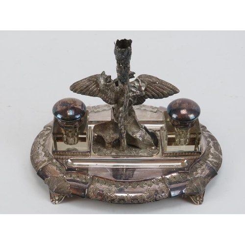 300 - Two Victorian silver plated desktop ink stands. Comprising an ink stand with square section inkwells... 