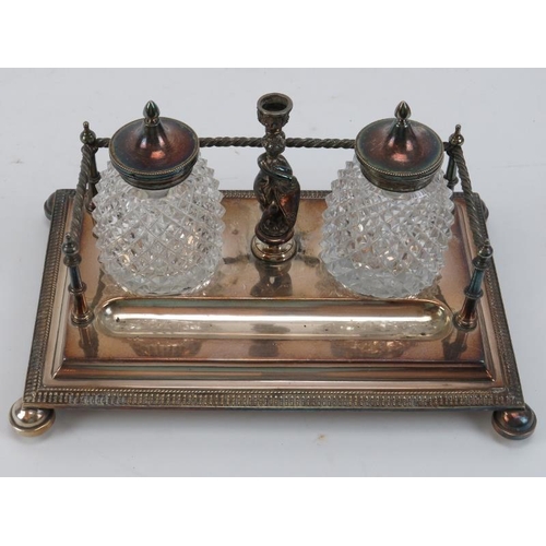 300 - Two Victorian silver plated desktop ink stands. Comprising an ink stand with square section inkwells... 