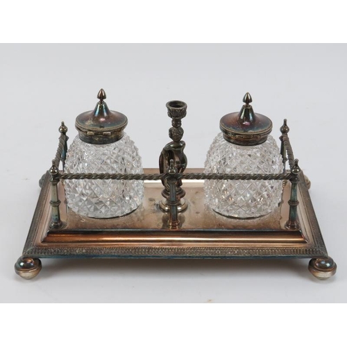 300 - Two Victorian silver plated desktop ink stands. Comprising an ink stand with square section inkwells... 