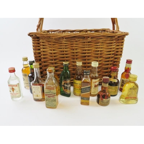 325 - 50 mixed miniatures including many whiskies, brandies, vodkas, gins, liqueurs etc, all contained in ... 