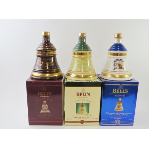 330 - Three boxed Bell's Scotch whisky decanters with contents, including Christmas 2002, Christmas 1998 a... 