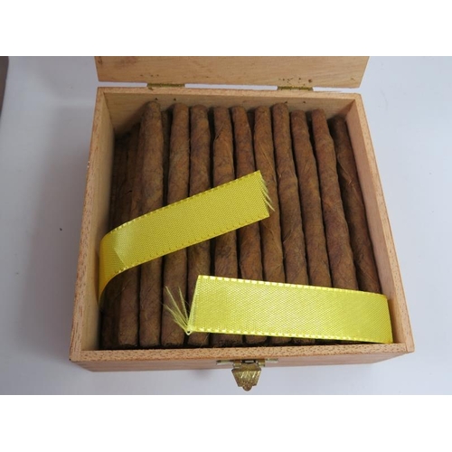 333 - A cedar wood cigar humidor with contents including a leather cigar case and various cigars and tubes... 