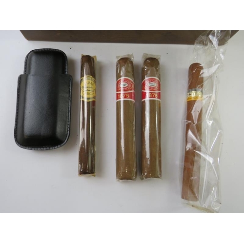 333 - A cedar wood cigar humidor with contents including a leather cigar case and various cigars and tubes... 