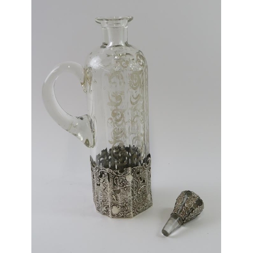 352 - A 19th century facet cut silver mounted decanter with wheel engraving to the body and repousse silve... 