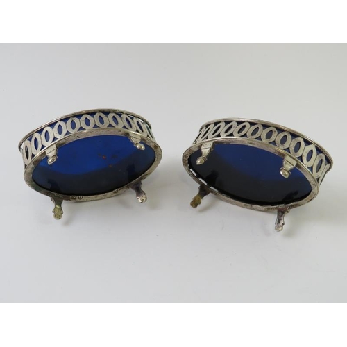 356 - A pair of continental white metal salts with blue glass liners and a silver mounted Dutch silver bot... 