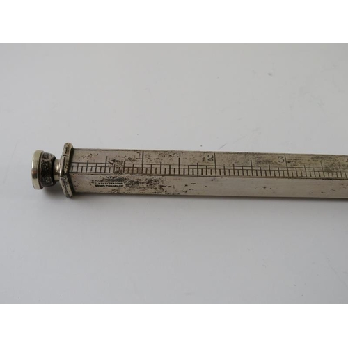 359 - An unusual Edwardian silver desk ruler with pencil inserts at each end. Retailer's stamp for A Barre... 