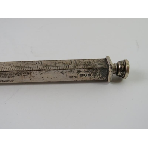 359 - An unusual Edwardian silver desk ruler with pencil inserts at each end. Retailer's stamp for A Barre... 