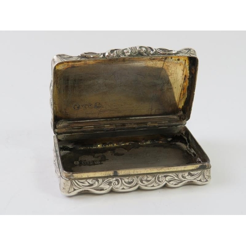 363 - A mid 19th century silver snuff box with overall foliate engraved decoration. Hallmarked for Birming... 