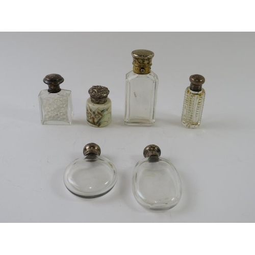 368 - Six antique silver mounted perfume bottles including one decorated porcelain example. Tallest 8cm. (... 