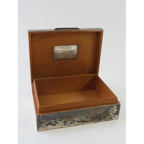 370 - A 1960s undecorated silver cigarette box with cedar wood lining and weighted base. Hallmarked for Lo... 