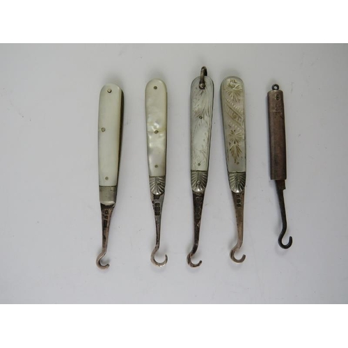 378 - A collection of silver mounted mainly 19th century glove button hooks including five folding example... 