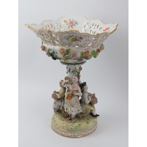 38 - A large German Dresden porcelain comport, circa 1888 - 1901. Modelled with figures surrounding the s... 