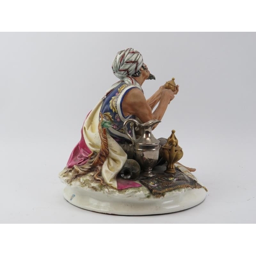 39 - A large Capodimonte figure of an Arabian merchant, 20th century. Naples factory mark to base. 24 cm ... 