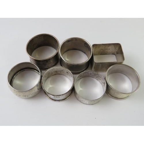 398 - Seven silver napkin rings of various design.  All fully hallmarked, various dates and makers. Gross ... 