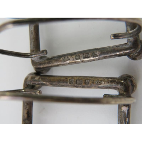 399 - A pair of Edwardian silver four slice toast racks on ball feet. Hallmarked for Birmingham 1902/03, m... 