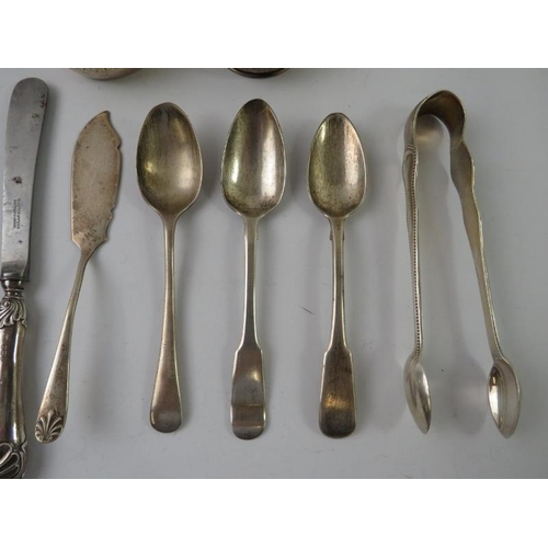 408 - A mixed lot of hallmarked silver items including spoons, sugar tongs, knives, napkin rings and a but... 