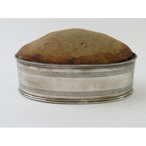 411 - An early 20th century silver mounted hatpin cushion, hallmarked for Birmingham 1913, maker Horton & ... 