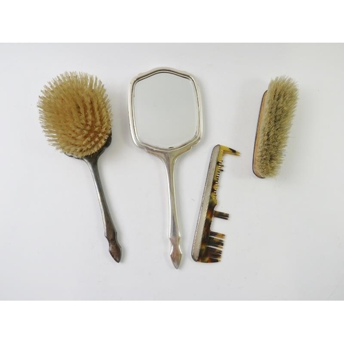 416 - A four piece Art Deco revival silver backed vanity set comprising mirror, two brushes and a comb. Ha... 