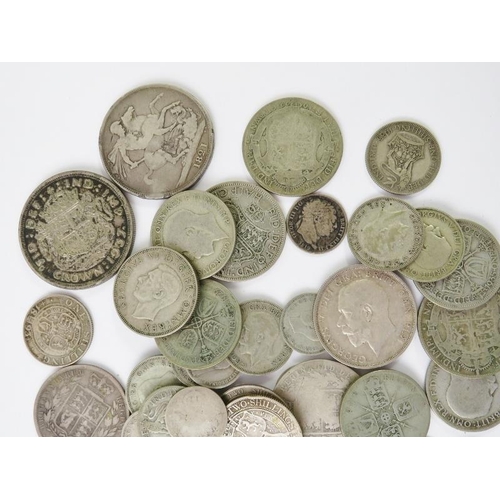 425 - A collection of British pre-1947 silver coins from George III-George VI, including sixpences, shilli... 