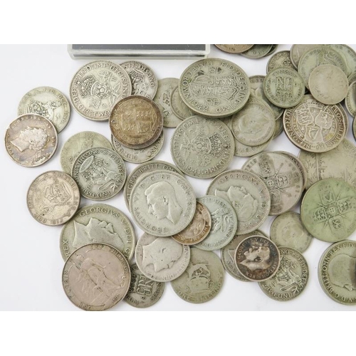 425 - A collection of British pre-1947 silver coins from George III-George VI, including sixpences, shilli... 