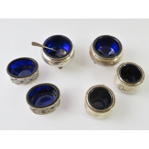 434 - Three pairs of silver salt cellars with blue glass liners, and a silver salt spoon. Various hallmark... 