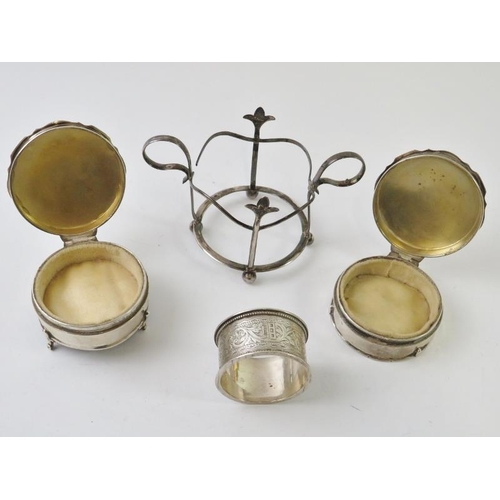 436 - A pair of silver ring boxes with velvet liners and weighted bases, a silver napkin ring and a silver... 