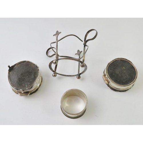 436 - A pair of silver ring boxes with velvet liners and weighted bases, a silver napkin ring and a silver... 