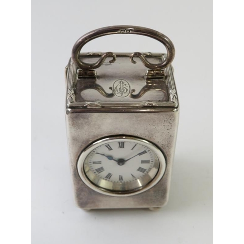 437 - An early 20th century Mappin & Webb silver carriage clock of diminutive size, with ribbon and read d... 