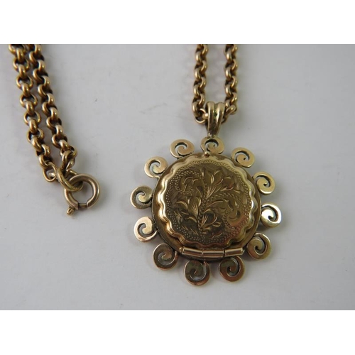 442 - A 9ct yellow gold locket with scrolls and engraved decoration and later 9ct yellow gold bale/loop at... 