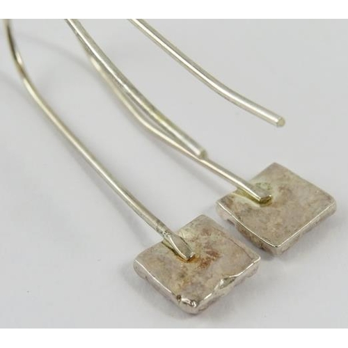 445 - A pair of Artisanal silver earrings with square pendants below long shepherds crook fittings, 4cm lo... 