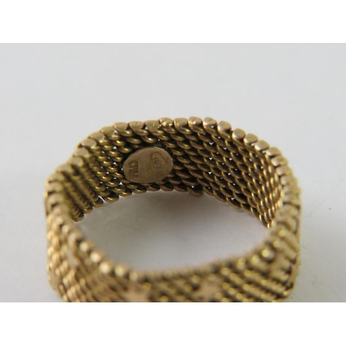 458 - An Italian precious metal woven mesh ring with star decoration, stamped 750  409AL and testing as 18... 