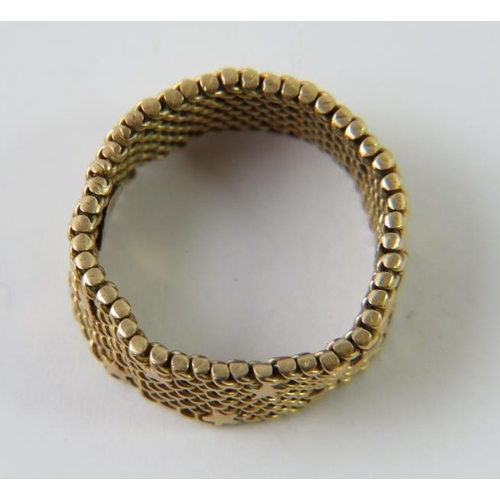 458 - An Italian precious metal woven mesh ring with star decoration, stamped 750  409AL and testing as 18... 