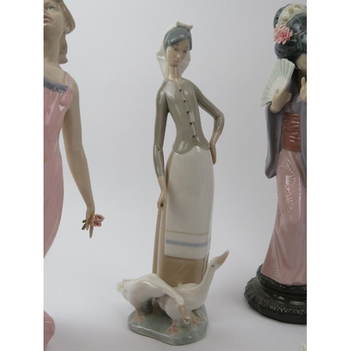 46 - A group of Lladro, Nao and similarly decorated porcelain figurines. (10 items) 33 cm tallest height.... 