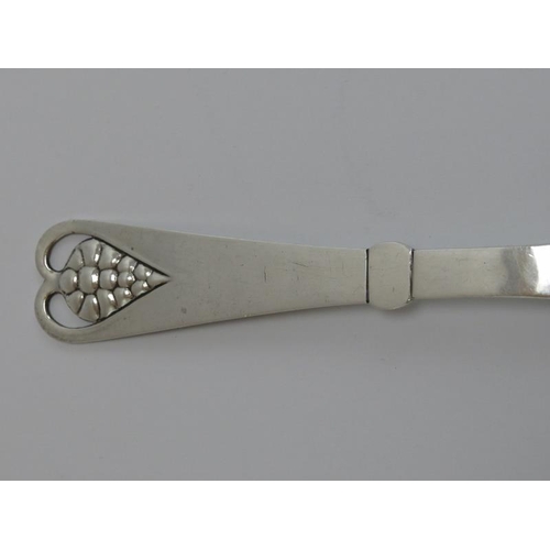 47 - A Georg Jensen Danish sterling silver berry serving spoon. The terminal openwork decorated with a ra... 