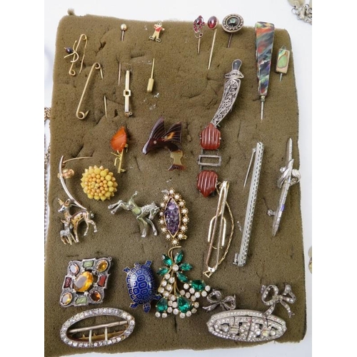 477 - A quantity of stick pins, some stone/gem set and other paste and costume jewellery to include brooch... 