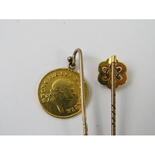 487 - A George III Third Guinea dated 1808 mounted as a stick pin; and another floral stick pin set with a... 