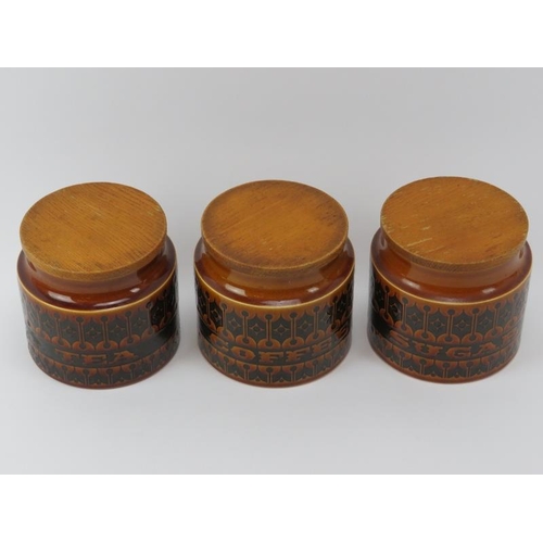 49 - Three Hornsea ceramic ‘Heirloom' pattern tea, coffee and sugar kitchen storage jars with oak covers,... 