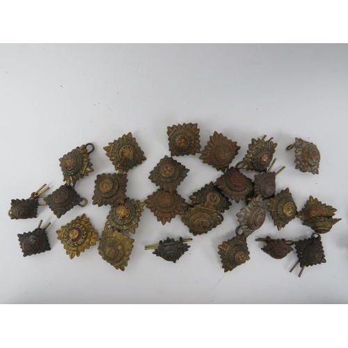 53 - Militaria: A collection of British Army WWI / WWII period badges, pips and buttons and a group of pr... 