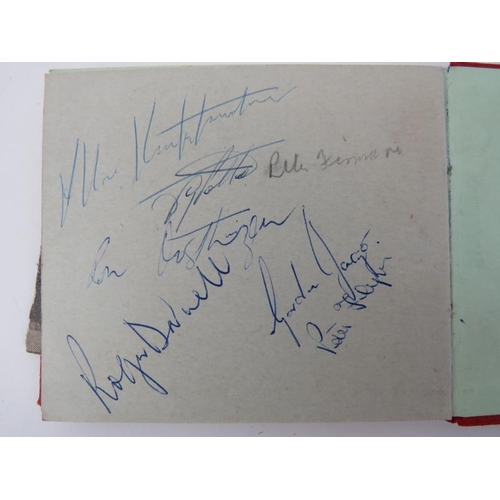 54 - Sporting memorabilia: A vintage autograph album containing signatures of British football players, c... 