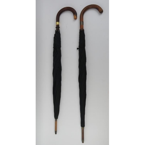 55 - Two vintage crook handled umbrellas by Brigg of London, early 20th century. With a silver collar and... 