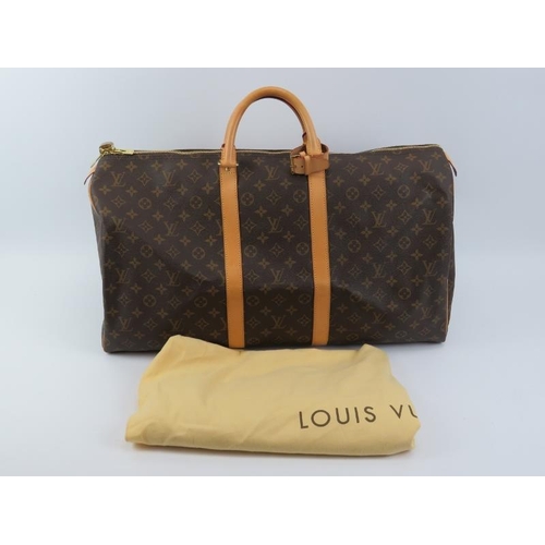 56 - A Louis Vuitton Keepal 55 monogram canvas weekend bag. Complete with poani and padlock and original ... 